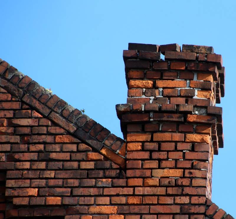 Damaged chimney on an Boylston home showing cracks and missing mortar